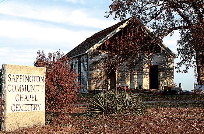 The Sappington Community Chapel building on Route F, shown in the process of being demolished, is no more. Plans are to construct a shelter on the site for use for the community meetings and visitors to the Sappington Cemetery which is still in use.